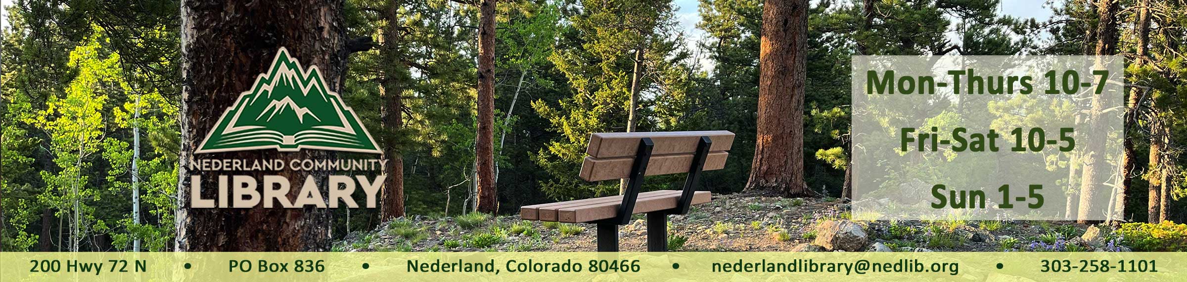 photo of bench in the woods with library hours