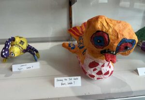 Two figures of student art